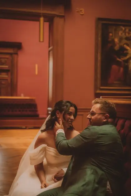 Couple on a bordeaux sofa