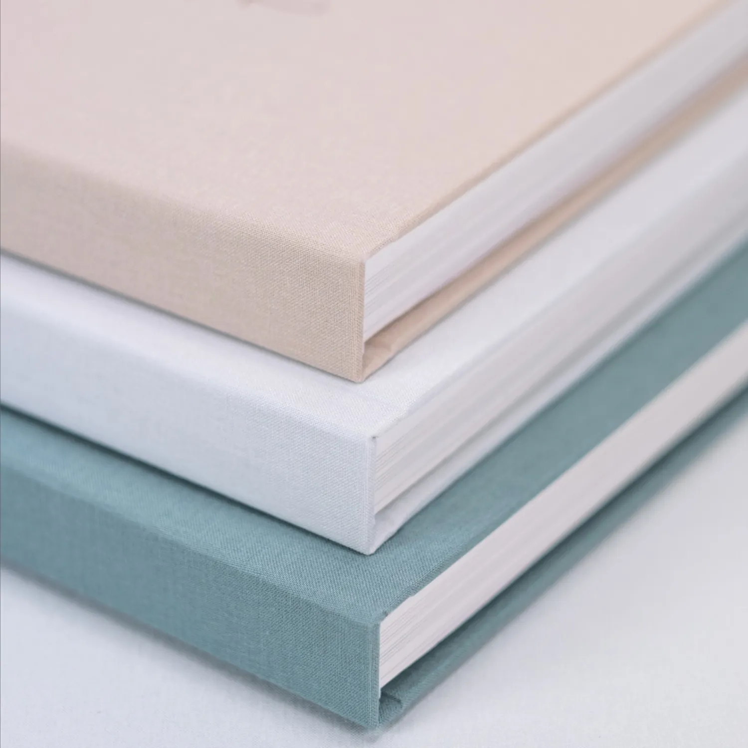 Linen albums in beige, white and blue green